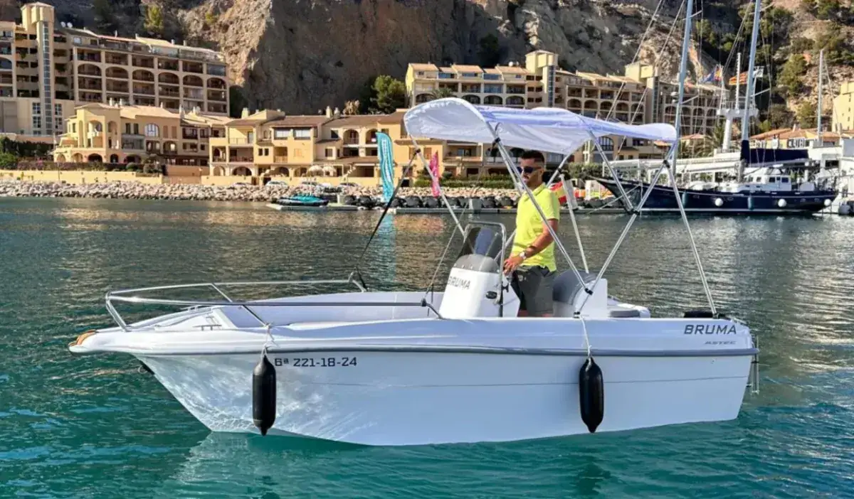 License-free boat navigating along the Costa Brava coast